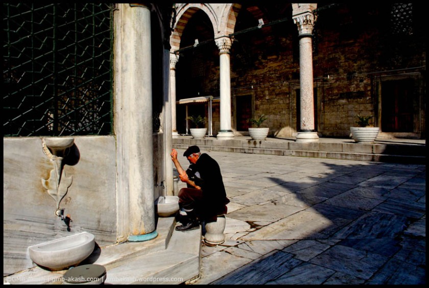 A muslim man is preparing himself for his prayer